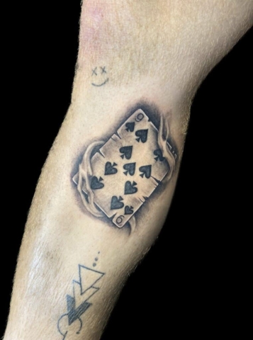 Black and grey playing card tattoo, Jackie Gutierrez , Tattoo Artist at Revolt Tattoos in Las Vegas