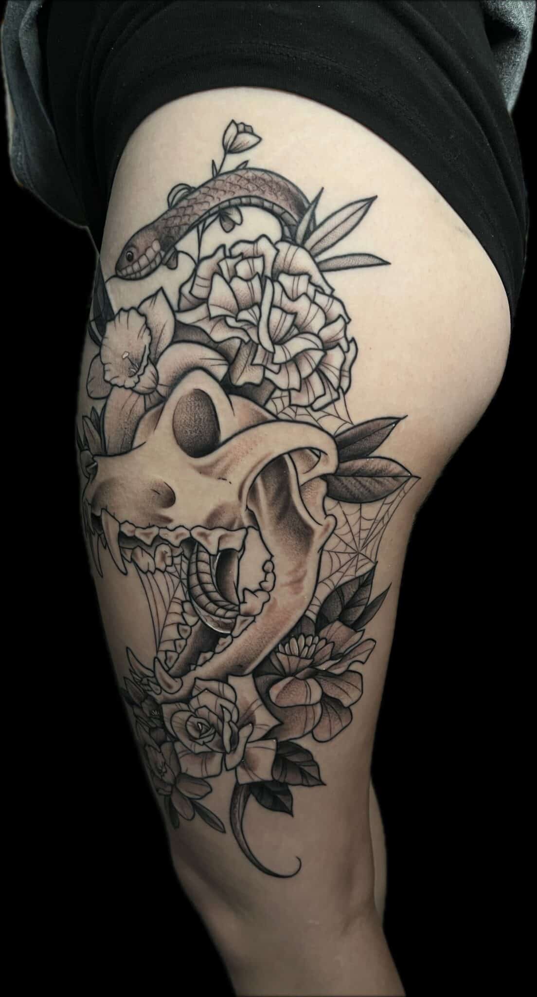 skull snake and flowers tattoo Demi DiMartino, artist at Revolt Tattoos