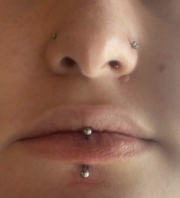 Nostril and lip piercings