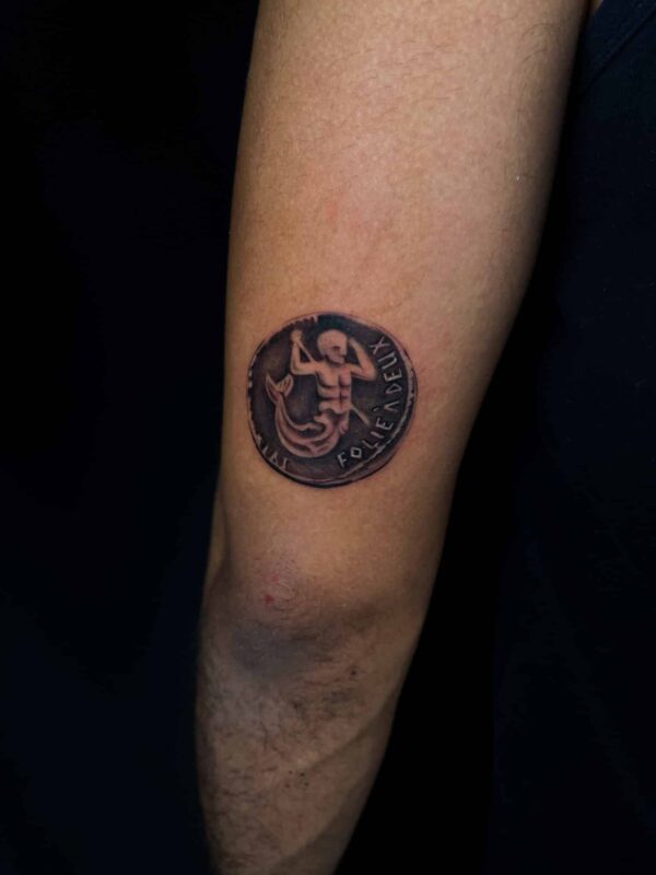 Realistic coin tattoo, Demi DiMartino, artist at Revolt Tattoos