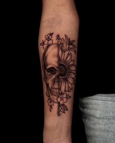 skull floral forearm tattoo,Demi DiMartino, artist at Revolt Tattoos