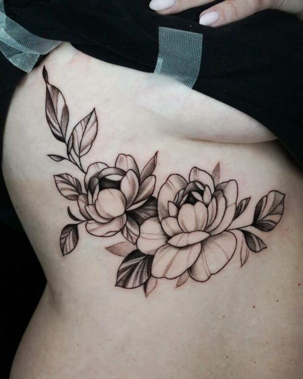 floral rib tattoo, Demi DiMartino, artist at Revolt Tattoos