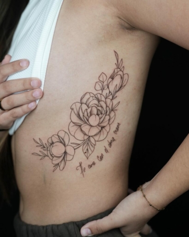 floral rib piece tattoo, Demi DiMartino, artist at Revolt Tattoos