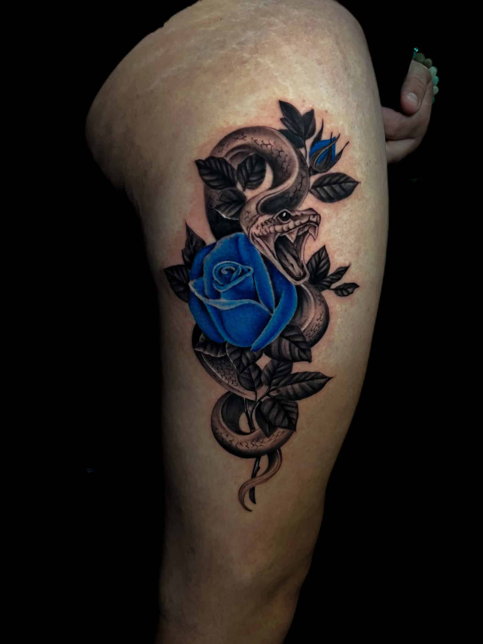 black and grey photorealistic snake and blue rose, Demi DiMartino, artist at Revolt Tattoos