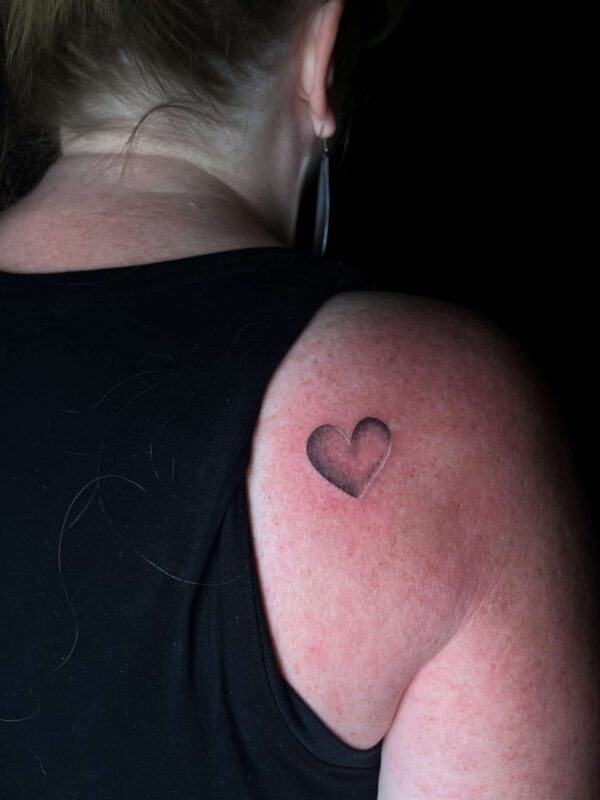 heart on back shoulder, Demi DiMartino, artist at Revolt Tattoos