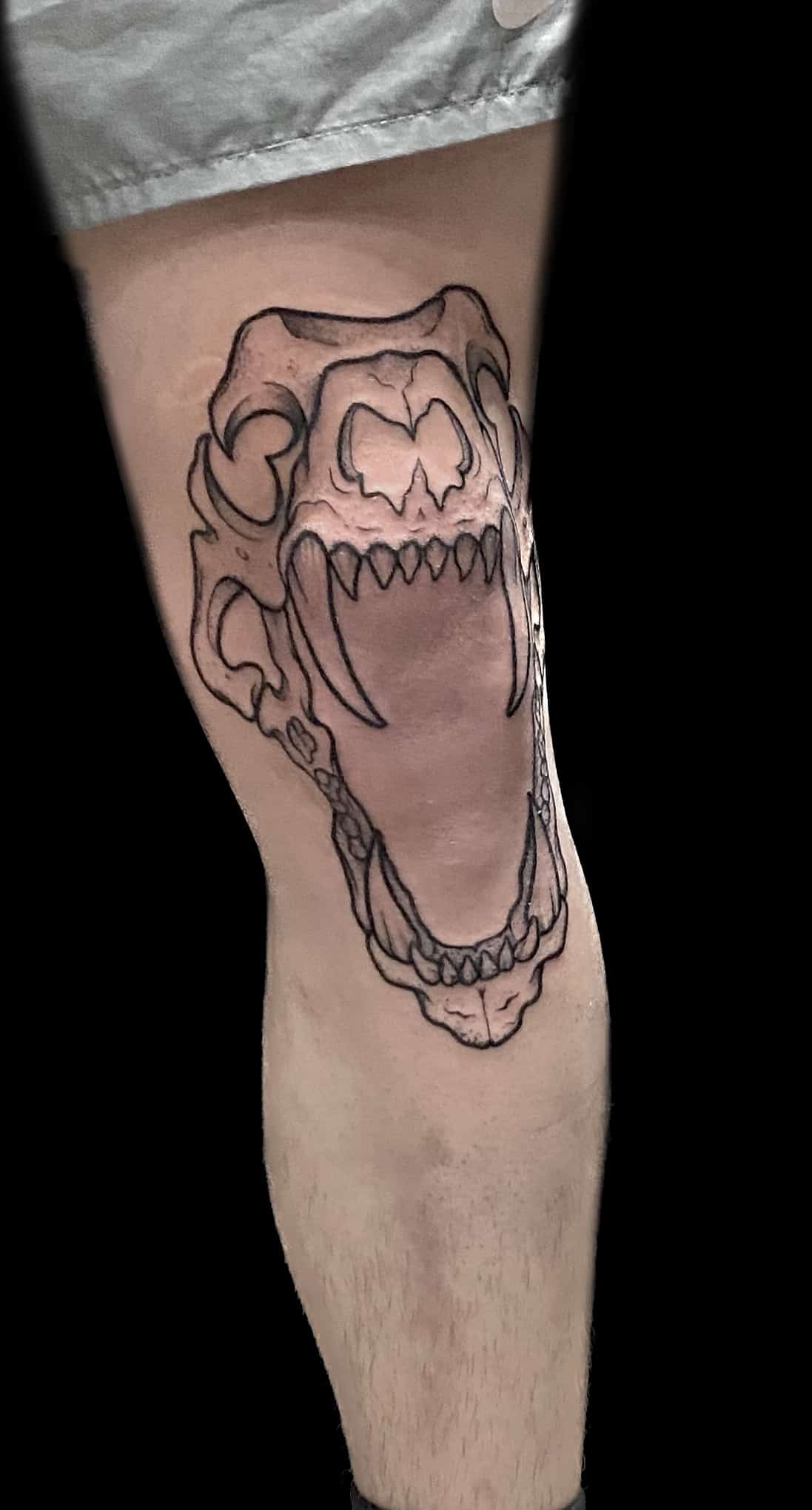 outline skull knee tattoo, Jackie Gutierrez , Tattoo Artist at Revolt Tattoos in Las Vegas