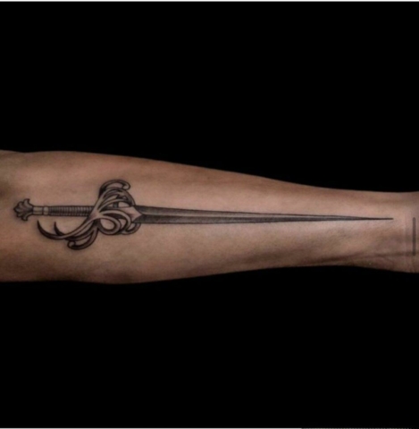 sword, needle tattoo Brooke Lozano, Artist at Revolt Tattoos Houston
