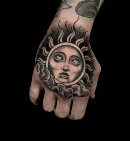 sun hand tattoo, black and grey, Brooke Lozano, Artist at Revolt Tattoos Houston