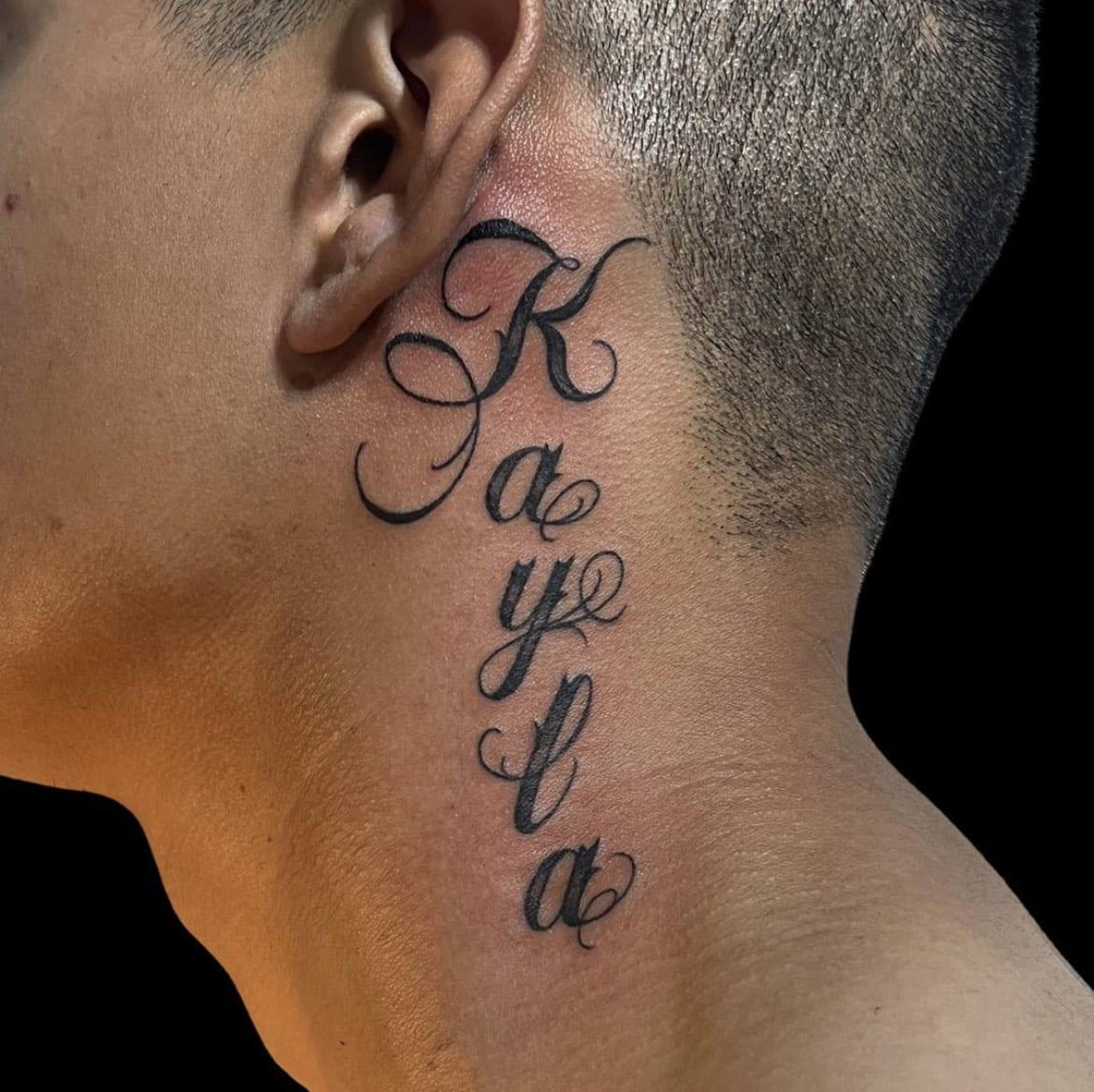 lettering behind ear, Brooke Lozano, Artist at Revolt Tattoos Houston