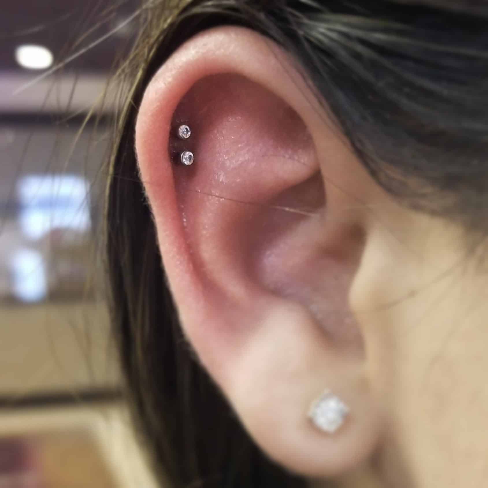 Double helix piercing, Savvy, Piercer at Revolt Tattoos in Lake Tahoe