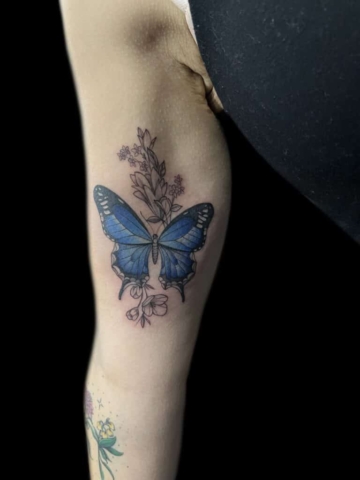 Butterfly Inner arm flower tattoo | Demi DiMartino | Tattoo Artist at Revolt Tattoos in Las Vegas, Nevada.